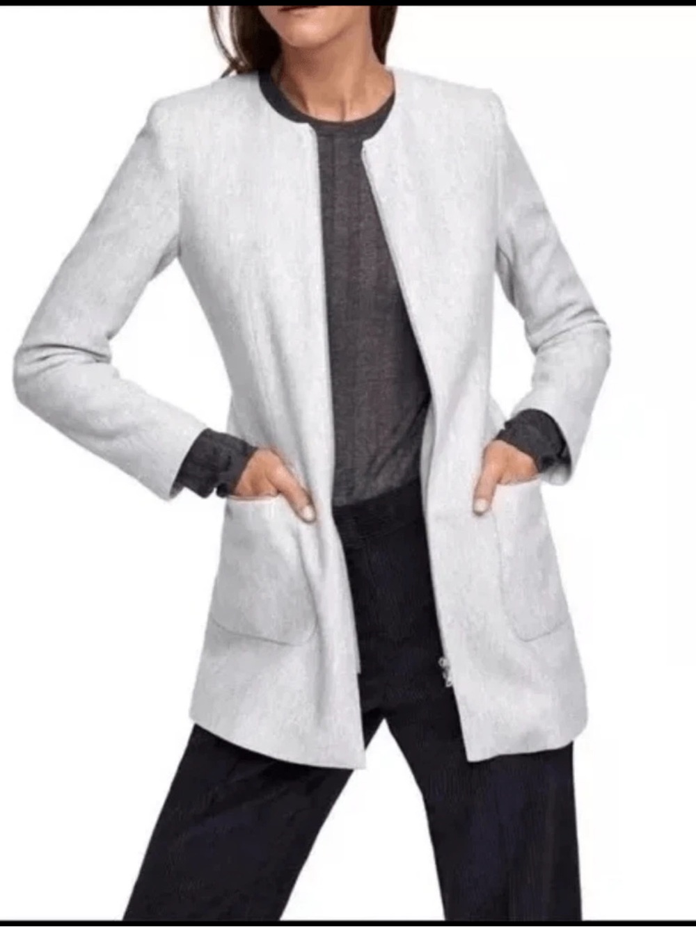 Zara zip-front jacket features a collarless round neckline and large front patch